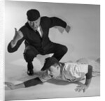 1950s baseball umpire calling sliding player out studio shot by Anonymous