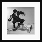 1950s baseball umpire calling sliding player out studio shot by Anonymous