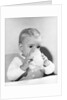 1950s boy toddler drinking glass milk looking at camera by Anonymous