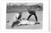 1950s little league umpire calling safe player sliding into home plate by Anonymous