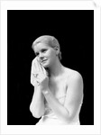1930s blond woman washing face with washcloth towel by Anonymous