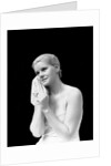 1930s blond woman washing face with washcloth towel by Anonymous