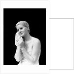 1930s blond woman washing face with washcloth towel by Anonymous