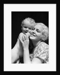 1930s blonde woman mother smiling holding baby to cheek by Anonymous