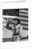 1940s boy scout playing bugle in front of 48 star american flag by Anonymous