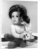 1960s baby wearing coonskin hat by Anonymous