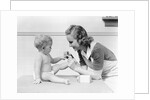 1930s mother touching baby toes fingers this little piggy nursery rhyme by Anonymous