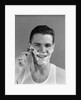 1940s smiling man shaving wearing tee shirt by Anonymous