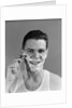 1940s smiling man shaving wearing tee shirt by Anonymous