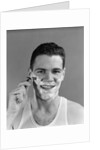 1940s smiling man shaving wearing tee shirt by Anonymous