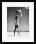 1960s woman in stripes swim suit bathing holding beach ball standing on tip toes by Anonymous