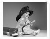 1960s baby fireman with safety hat coat and fire extinguisher by Anonymous