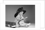 1960s baby fireman with safety hat coat and fire extinguisher by Anonymous