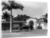 1930s car in circular driveway of tropical stucco spanish style home in sunset islands miami beach florida usa by Anonymous