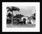 1930s car in circular driveway of tropical stucco spanish style home in sunset islands miami beach florida usa by Anonymous