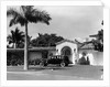 1930s car in circular driveway of tropical stucco spanish style home in sunset islands miami beach florida usa by Anonymous