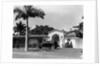 1930s car in circular driveway of tropical stucco spanish style home in sunset islands miami beach florida usa by Anonymous