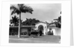 1930s car in circular driveway of tropical stucco spanish style home in sunset islands miami beach florida usa by Anonymous