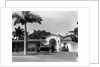 1930s car in circular driveway of tropical stucco spanish style home in sunset islands miami beach florida usa by Anonymous