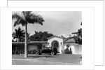 1930s car in circular driveway of tropical stucco spanish style home in sunset islands miami beach florida usa by Anonymous