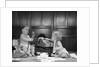 1960s 2 babies in diapers one on chair with telephone other on floor with adding machine pencil behind ear by Anonymous