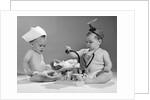 1960s two babies playing doctor and nurse with doll studio by Anonymous
