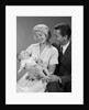 1960s happy mother and father smiling at their baby by Anonymous