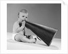 1960s baby in diaper seated holding megaphone by Anonymous