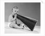 1960s baby in diaper seated holding megaphone by Anonymous