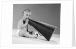 1960s baby in diaper seated holding megaphone by Anonymous