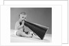 1960s baby in diaper seated holding megaphone by Anonymous