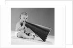 1960s baby in diaper seated holding megaphone by Anonymous