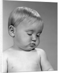 1960s portrait baby nodding off to sleep by Anonymous
