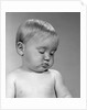 1960s portrait baby nodding off to sleep by Anonymous