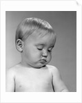 1960s portrait baby nodding off to sleep by Anonymous