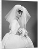 1960s bride portrait in wedding dress veil bridal bouquet by Anonymous