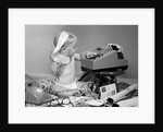 1960s baby with adding machine telephone blueprints paint samples and tape measure by Anonymous