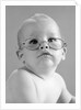 1960s baby wearing wire-rimmed granny glasses by Anonymous