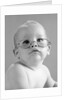 1960s baby wearing wire-rimmed granny glasses by Anonymous