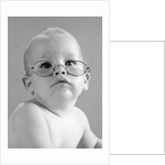 1960s baby wearing wire-rimmed granny glasses by Anonymous