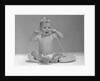 1960s blond baby sitting up looking at camera chewing on telephone cord by Anonymous