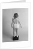 Back view of chubby girl wearing panties weighing herself by Anonymous