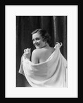 1930s smiling brunette woman looking over shoulder drying back with towel looking at camera by Anonymous