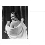 1930s smiling brunette woman looking over shoulder drying back with towel looking at camera by Anonymous