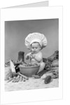 1950s 1960s baby wearing chef hat toque bowl and raw vegetables making a salad by Anonymous