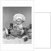1950s 1960s baby wearing chef hat toque bowl and raw vegetables making a salad by Anonymous