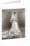 1950s full length portrait bride standing wearing satin and lace wedding gown veil and tiara looking at camera by Anonymous