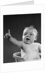 1940s 1950s baby sitting in chair arm and one finger raised objecting voting making a point looking at camera by Anonymous