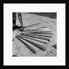 1950s baseball player selecting from a variety of bats by Anonymous