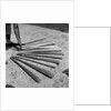 1950s baseball player selecting from a variety of bats by Anonymous